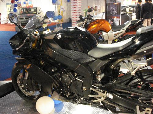 yamaha yzf r1 - the best in the block from the den of yamaha . its 1000cc four cylinder liquid cooled engine churning out 196 bhp of raw power sure to make you go nuts. picking up a speed of 100miles an hour in first gear only and a top speed over 220miles an hour it probabaly is the fastest bike in the world for the time being... what do you say??