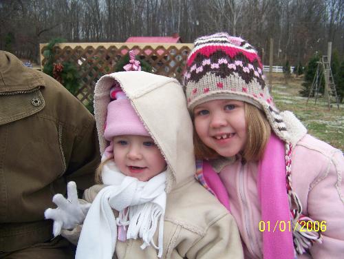 Girls at tree farm - This is my girls at the Christmas tree farm on the hayride to find a tree. It has been a tradition for my husband and I for 7 years and our girls since about age 1.