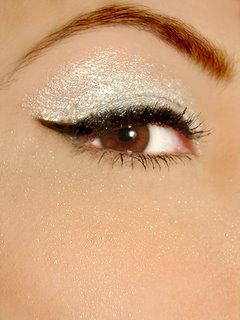 eyeliner  - eyes defined beautifully with eyeliner and enhanced its look with silver eyeshadow