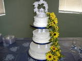 cake - One of the first wedding cakes I ever made. This was done for a co-worker's daughter. Traditional white cake with a lemon cream filling and buttercream frosting.