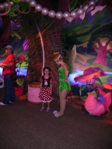 my daughter - my daughter with a fairy at disney world. tinker bell