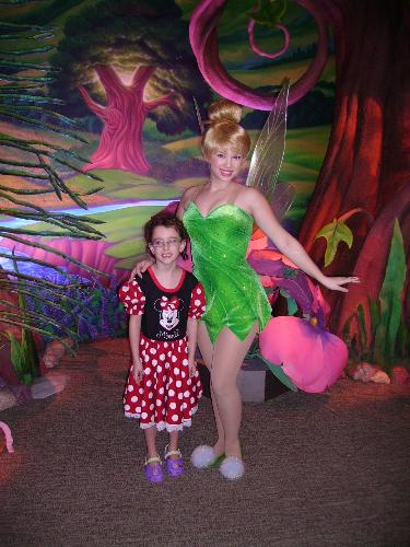 tinker bell - my daughter with a fairy at disney world.