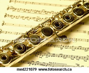 Picture of a flute - Picture of a flute on top of a piece of sheet music