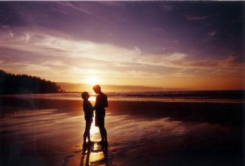 couple at the beach - dating couple at the beach holding hands