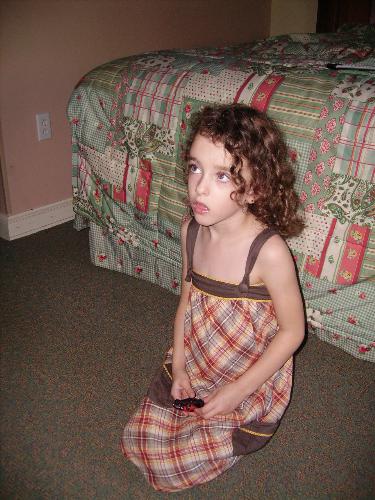 disney hotel - my daughter sitting watching tv in our disney hotel room