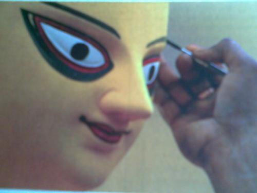 Final Touch - Artist giving final Touch at devi's Eyes(ChakshuDaan)in Kumartuli,Kolkata.