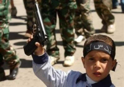 Arab kid with a gun - An arab three years old kid holds a gun. Arab kid with a gun - An arab three years old kid holds a gun.