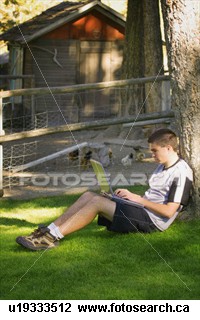 Teen working outside on computer - Teenager working outside on a laptop