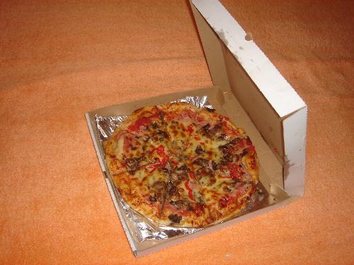 Pizza - Pizza is a world-popular dish of Italian origin, made with an oven-baked, flat, generally round bread that is often covered with tomatoes or a tomato-based sauce and mozzarella cheese