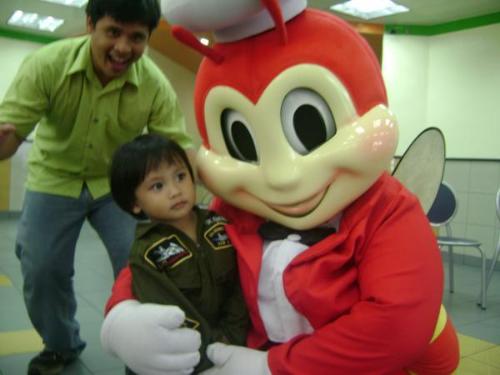 jollibee with my brother and nephew - Jollibee Foods Corporation widely known as Jollibee is a fast-food restaurant chain based in the Philippines. It is an American-style fast-food restaurant with Filipino-influenced dishes specializing in burgers, spaghetti, chicken and some local Filipino dishes. Currently the biggest fast-food chain in the country, it also has locations in the United States, Saudi Arabia, Hong Kong, Vietnam, Malaysia, Indonesia, Dubai and Brunei.