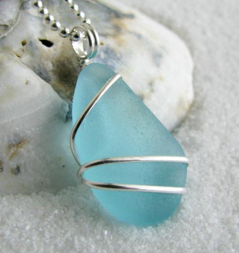 Soft Aqua Blue Teardrop Sea Glass Necklace - My latest sea glass jewelry creation...  This gorgeous piece of soft aqua blue teardrop shaped sea glass is just over 3/4' in length, wrapped in sterling silver wire & hangs on an 18' ball-style sterling silver chain. Longing for those warm summer days at the beach? Maybe this piece is what you need!