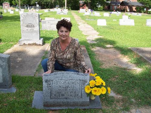 Ellen's new camera - Ellen in front of Dads grave