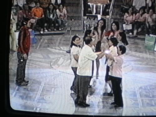 Game Show - People on a television game show.