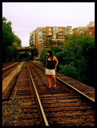 my artistic shot. - aren't railroad tracks really amazing? i can't really describe it. but it's me, last summer, being a goof and trying to be artistic.