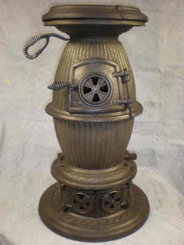 Pot Belly Stove - This 140 year old Pot Belly Stove is fully restored and is a spectacular addition to any home, or log cabin showroom.