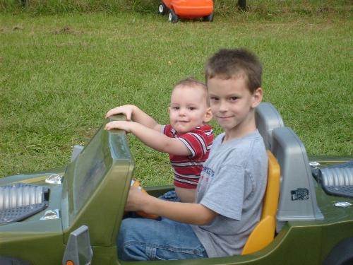 A boys day out - Big brother decided to take little brother for a ride around the yard
