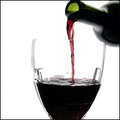 Red wine - A glass of red Merlot. Red wine - A glass of red Merlot.