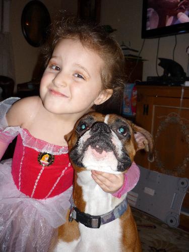 My niece Lexi and her Bandit  - My 3 1/2 year old niece, Lexi, showing some love for her 'favorite Banit,' my boxer. They are my two favorite cuties :D