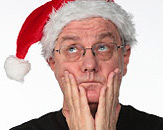 Stressful Christmas - Man stressed man is waiting for Christmas. He wears a red Santa hat.