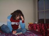 Me - This is a picture of me at a friends house. I was totally lost in the process of writing something and she decided to capture the moment with her camera.