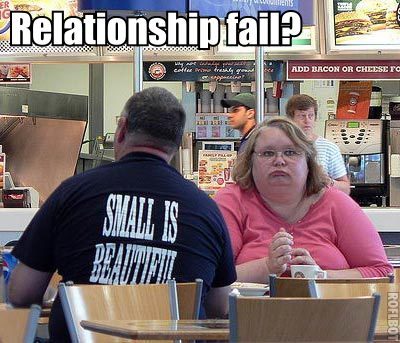 Failing Relationship  - Couple at a restaurant. She's being ignored by her date.