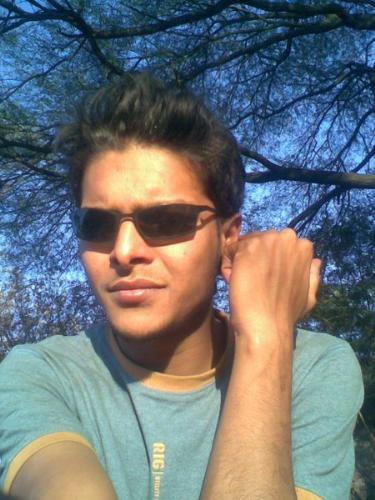 manish singh chauhan - i like this pic of mine the most i hope u alll like it too.... i believe its an awesome pic.. in the sun background of green with specs on n everything is in place...