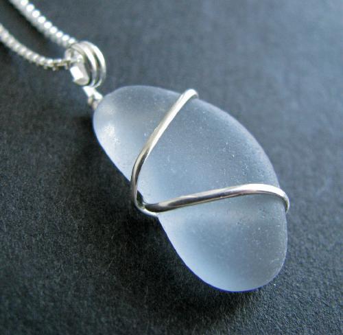 Gray Sea Glass Necklace - An extremely rare piece of authentic, flawless sea glass is wrapped with sterling silver wire and hangs on a Venetian box style sterling silver chain. Gray sea glass falls into the extremely rare color category of sea glass. It's estimated that finding a piece of gray happens 1 time for every 2,5000 pieces found. Finding a gray in 'jewelry quality' condition makes this piece even rarer. This piece is almost pastel like in color...and the nicest piece of gray I have ever seen.