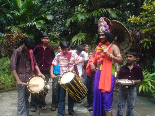 Mahabali. - Onam is a festival celebrated in Kerala.It is believed that Mahabali the king who once ruled Kerala comes to meet his people on this day.Flower carpets are laid and sweet dishes are made to greet him.This is a photo of 2008 onam in my husbands place.