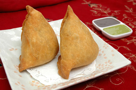 Keema Samosa - Keema Samosa is one of the most famous dish of India this dish is filled with meat(goat meat) chopped into thin pieces or if we want we can make it vegetarian by filling potatoes and different vegetables..