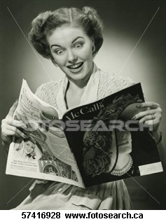 Woman reading a fashion magazine - Woman looking surprised, reading fashion magazine (B&W),