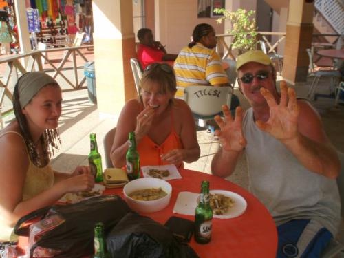 Tobago - This is me in Tobago with my mum and step-dad, we are trying a local dish - crab and dumplings!  It was actually quite tasty, though it did just look like green goo