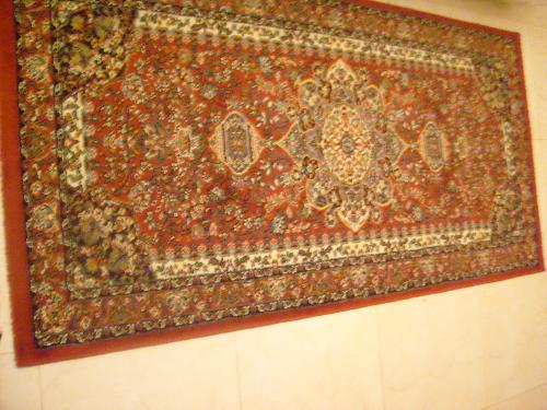 Red Rug - A red rug that lies on the floor of an apartment in Bahrain.