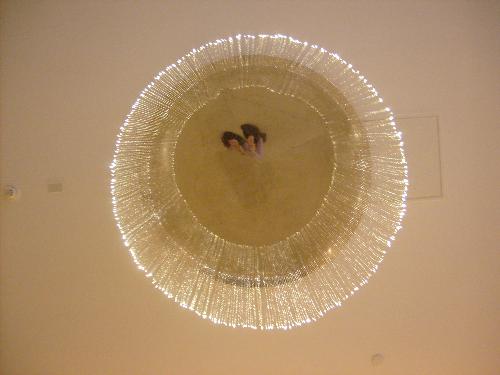 Underview of a light - The underside of a hanging lamp that dangles from the ceiling of a mall in Bahrain.