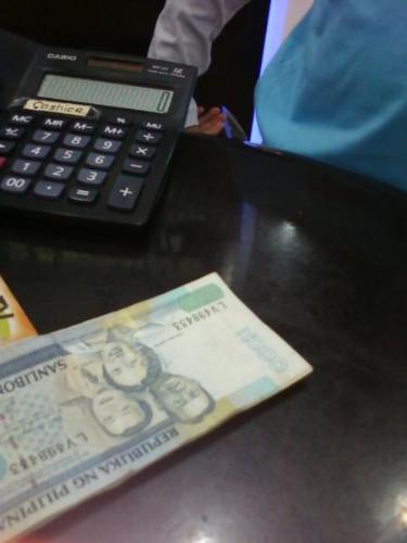 1000 pesos - this is a philippine money, worth 1,000 pesos...