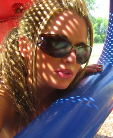 Tori Thompson - Modeling a pair of sunglasses