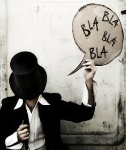 Blablabla - A picture of a guy holding a sign that says Bla Bla Bla.