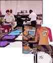 Textile printing company - printed t-shirts coming off the drier
