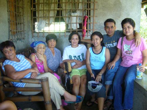 MY husband's family - These are my husband's family. They see each other once in a while and only during special occasions. They were 10 in the family and every one has a family of their own. They are living far from each other. They just communicate through telephone or by sending text or emails. This was taken last November, 2008 during all Saint's Day. Their mother was very happy on that they that she saw her siblings on that day.