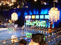 How does it sounds! - How it should sound is a TV show.
Two teams competing about song frazes.
Two team captains, each captain have one piano and two competers.
How does it sounds! - How it should sound is a TV show.
Two teams competing about song frazes.
Two team captains, each captain have one piano and two competers.