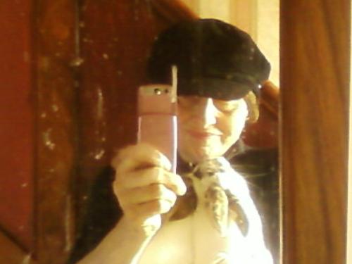 Me and Billy Bunn - I lost my digital camera, so this is the only recent pic I've got of me at the moment. It was taken on my rather insubstantial camera phone,by posing in front of a mirror! As you can see, it was a rather smeary mirror - Billy kept trying to lick his own reflection. Narcissistic, or what?  Billy Bunn is 3 years old, and currently single. He does live with another bun who is a bit of a tart, but Billy says it's a strictly platonic relationship. His interests include balloon popping, nutting the side of the divan bed when he misjudges his distance, and Cheshire cheese. He enjoys travelling and recently found himself in next door's garden, facing down their Rottweiler. He would like to see Australia because, as he points out, every other damn bun seems to live there.