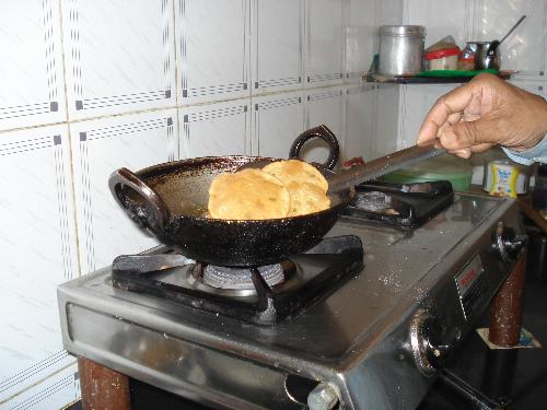 Cooking is my hubby's hobby - My hubby is busy in cooking 'Purries'