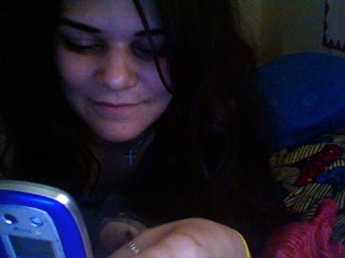 Me - Texting my fiance on my old cell phone.
