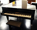 grand piano - Here is a grand piano. It is beautiful but takes up a lot of space in my living room.