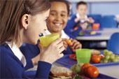 School - School cafeteria with kids eating
