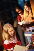 Library - Young girl in a library reading