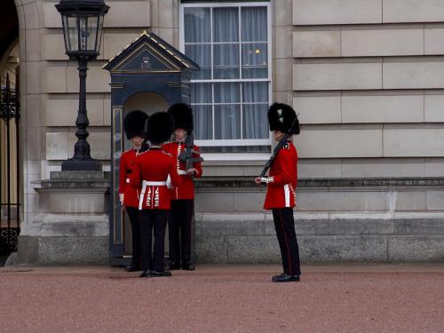 Men - Tower Bridge Guards with really nice outfits talking outside a building