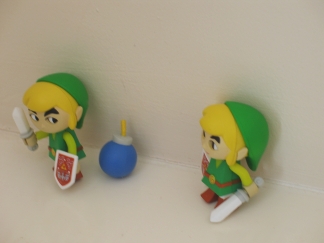 A couple of Wind Waker figures - Two little Links, sitting all alone.