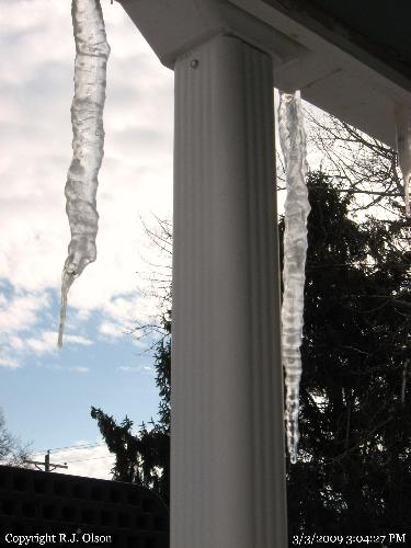 Melting Ice - I love watching the droplets of water cascading from the icicles on my roof.
