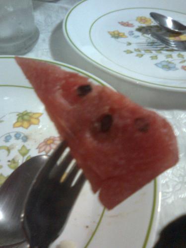 watermelon slice - Watermelons is mostly composed of water and sugar. Being high is sugar, it's not ideal for a strict diet. Photo from: http://yesterdaymeal.blogspot.com where I keep a food photo-log.