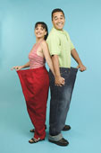 weight loss - A happy couple showing off their weight loss
